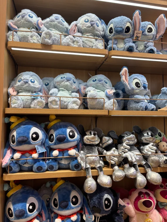 Stitch plush toys on shelves